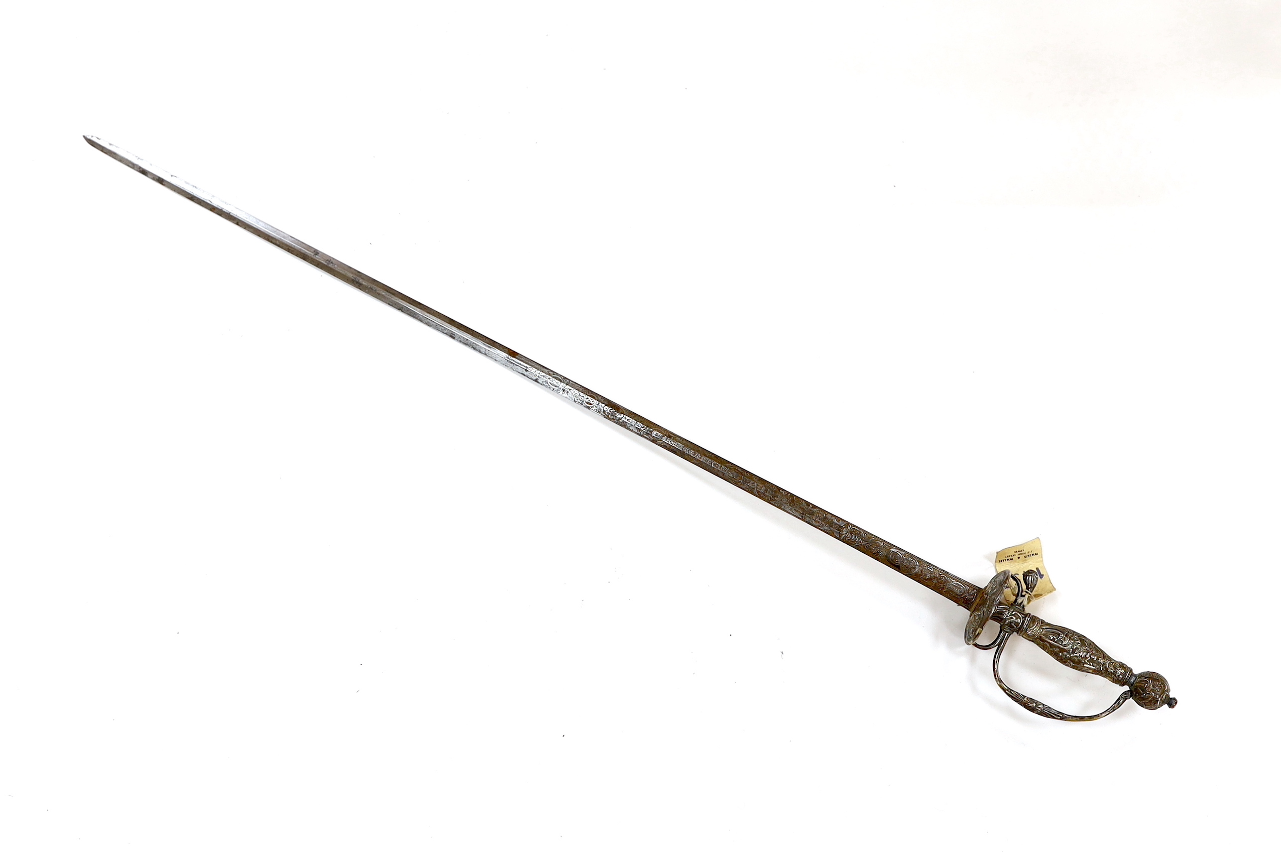 A French silver hilted small sword, c.1770, the guard, pommel and grip all chiselled with putti, flowers and rococo devices, blade etched with commensurate designs with retaining traces of gilding, blade 74cm